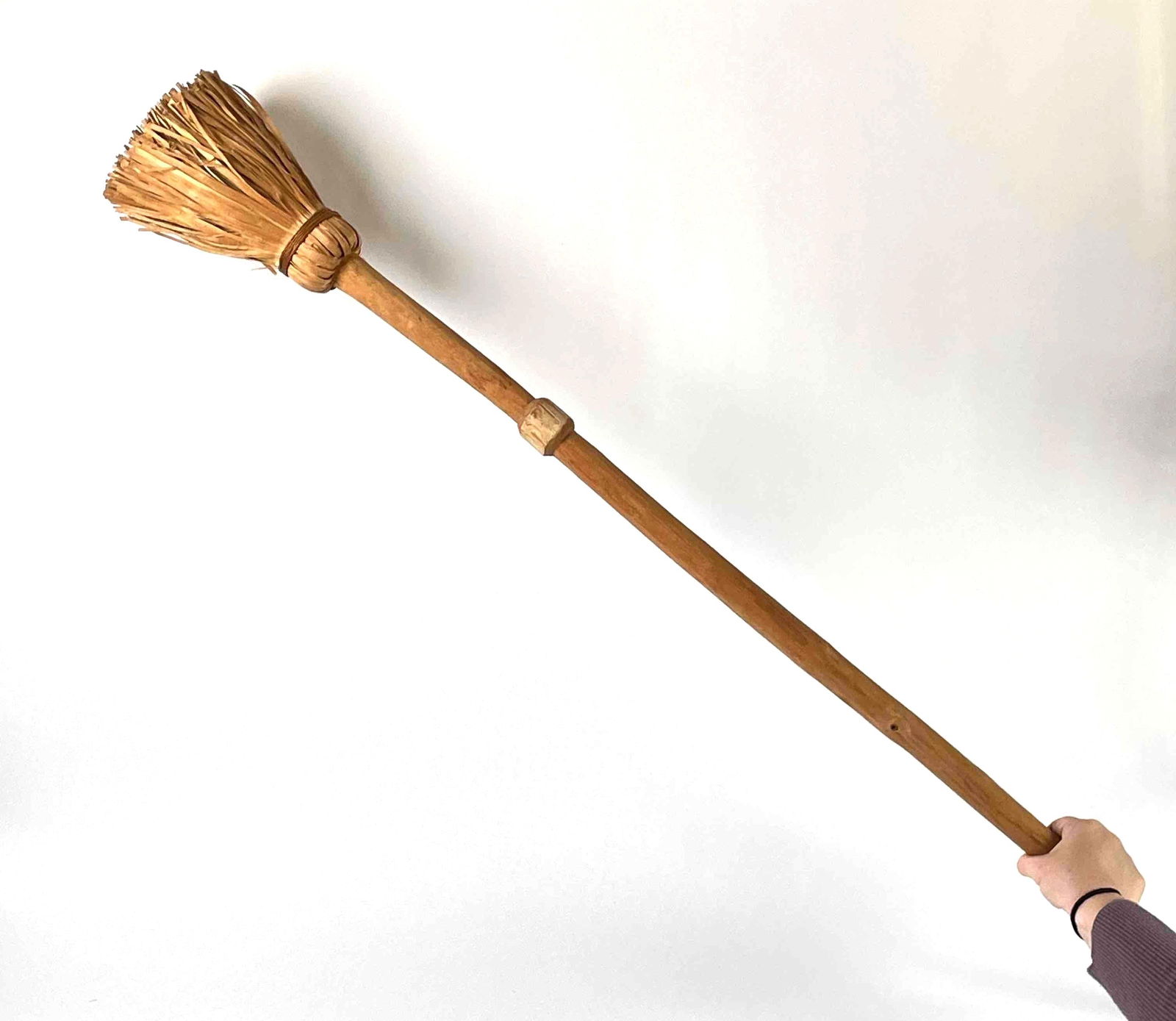Antique Hand Tied Wooden Broom (Native American): Antique hand tied natural fiber broom with wooden broomstick. From the home of a Native American collector. In good antique condition. please see photos for additional details. Dimensions: 50" x 6" x