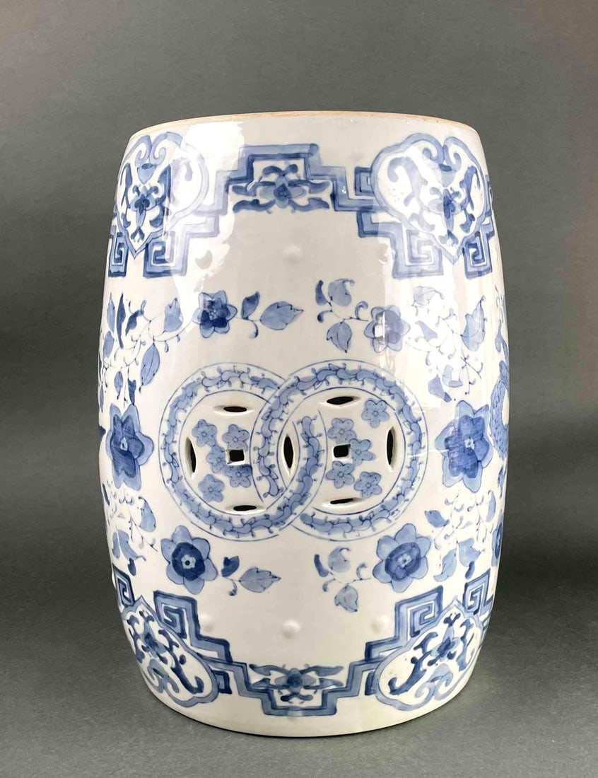 Chinese Blue and White Porcelain Garden Seat: Large blue and white porcelain Chinese garden seat. Seat has a barrel form with foliate motifs, and pierced details. Seat is hollow and bottom is not covered. Garden seat is in good condition with min