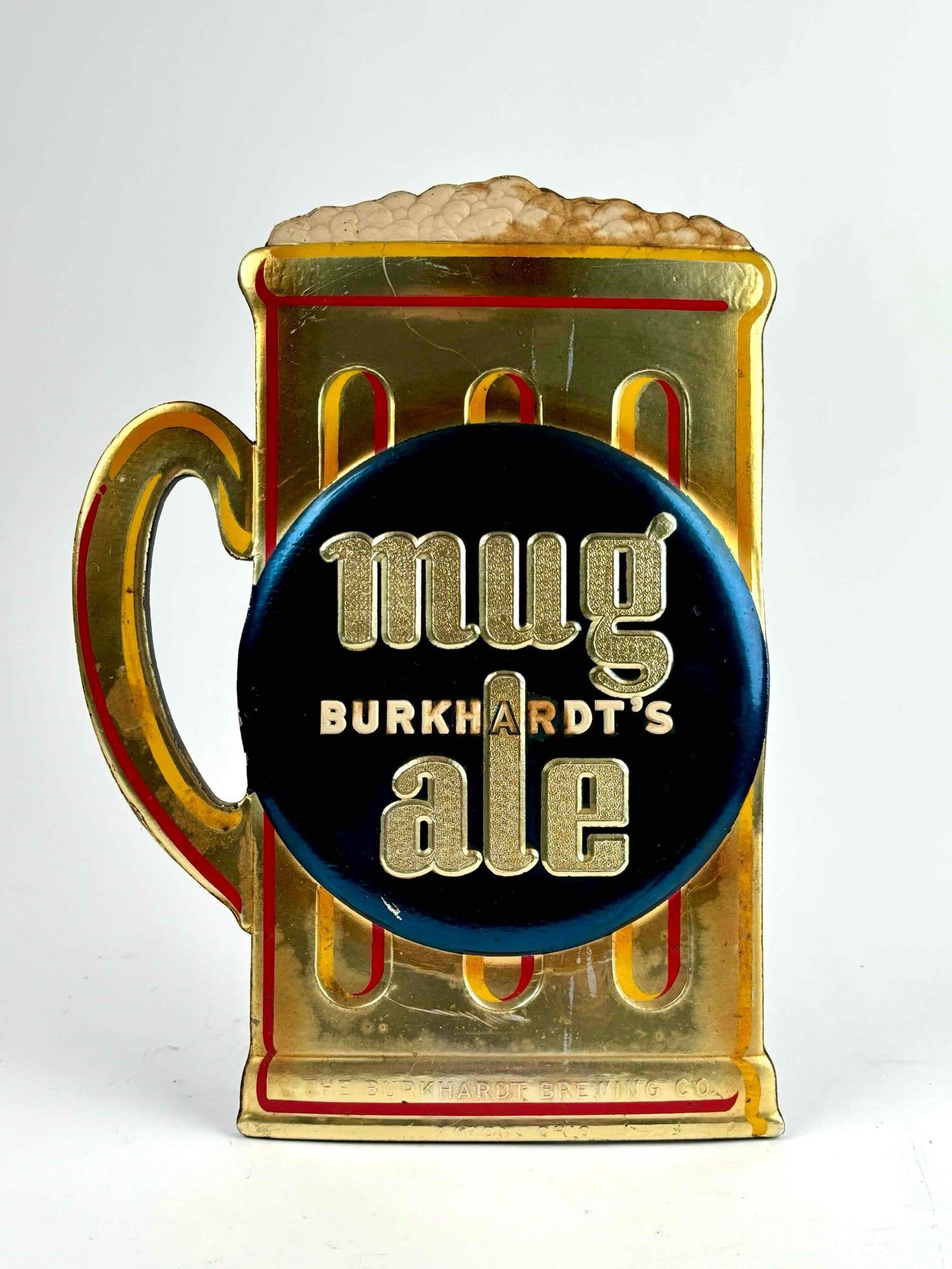 Vintage Burkhardt's Mug Ale Tin Advertisement (Akron, Ohio): Tin beer advertisement. Burkhardt's Mug Ale. Akron Ohio. Tin sign is in good vintage condition with signs of wear that are consistent with age and use. Scratches to surface and discoloration. Please s
