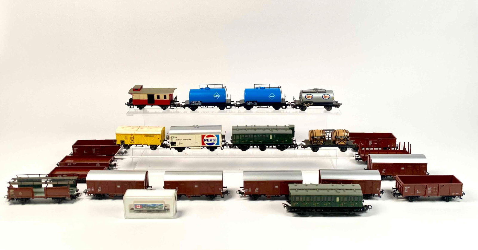Group of Marklin HO Scale Freights, Tankers, Passengers, Etc. (Vintage): Group of Marklin HO scale trains. Includes freights, Esso and Aral tank cars, Bordeaux Wine car, Pepsi freight, Jamaica freight, wagons, Marklin Canada Mini Club etc. Items manufactured in 1960s-1990s