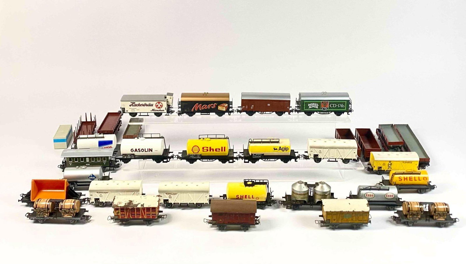 Group of Marklin HO Scale Model Trains (Freights, Tank Cars, Cargo, Etc.): Group of Marklin HO scale model trains cars including freights, flat cars, Bordeaux Wine cars, Aral, Shell, Gatoil Agip tank cars, CD-Pils cargo car, poultry car, Jamaica freight, Mars freight, and mo