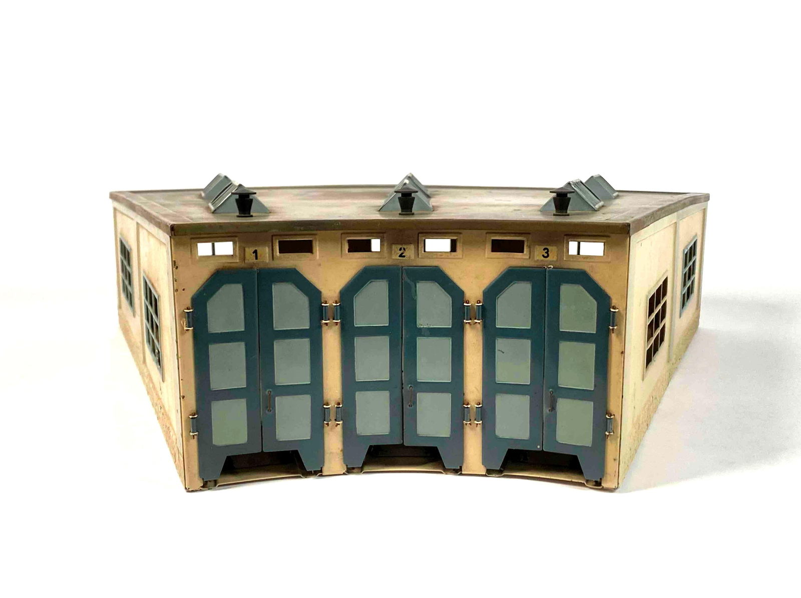 Vintage Marklin Metal Three Stall Roundhouse (7028): Marklin metal three stall roundhouse. Model 7028. Manufactured in the 1950s-1960s. Roundhouse is in good condition with signs of wear that are consistent with age and use such as surface scratching an