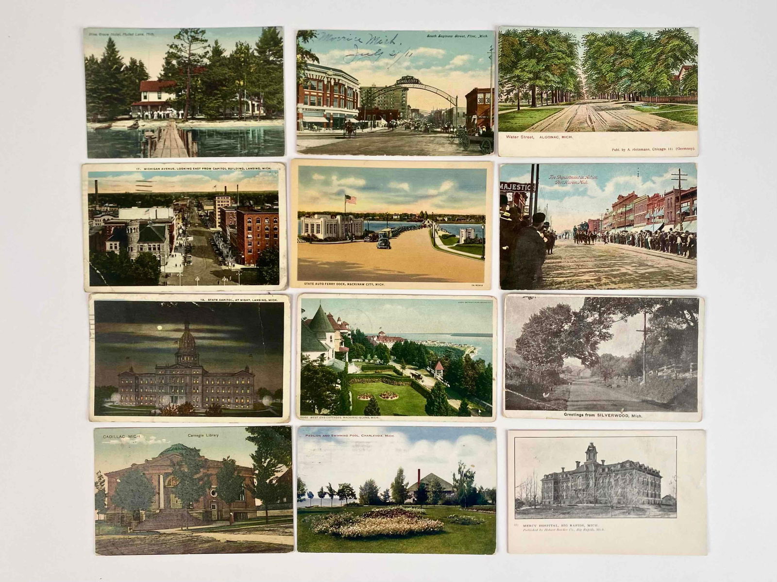 132 Early to Mid Twentieth Century Michigan Photo Post Cards: Group of 132 Michigan photo post cards from the early twentieth century. Includes post cards from scenic nature sightings, to city scenes, to facades. Includes photos of the Lansing State Capitol, Fli