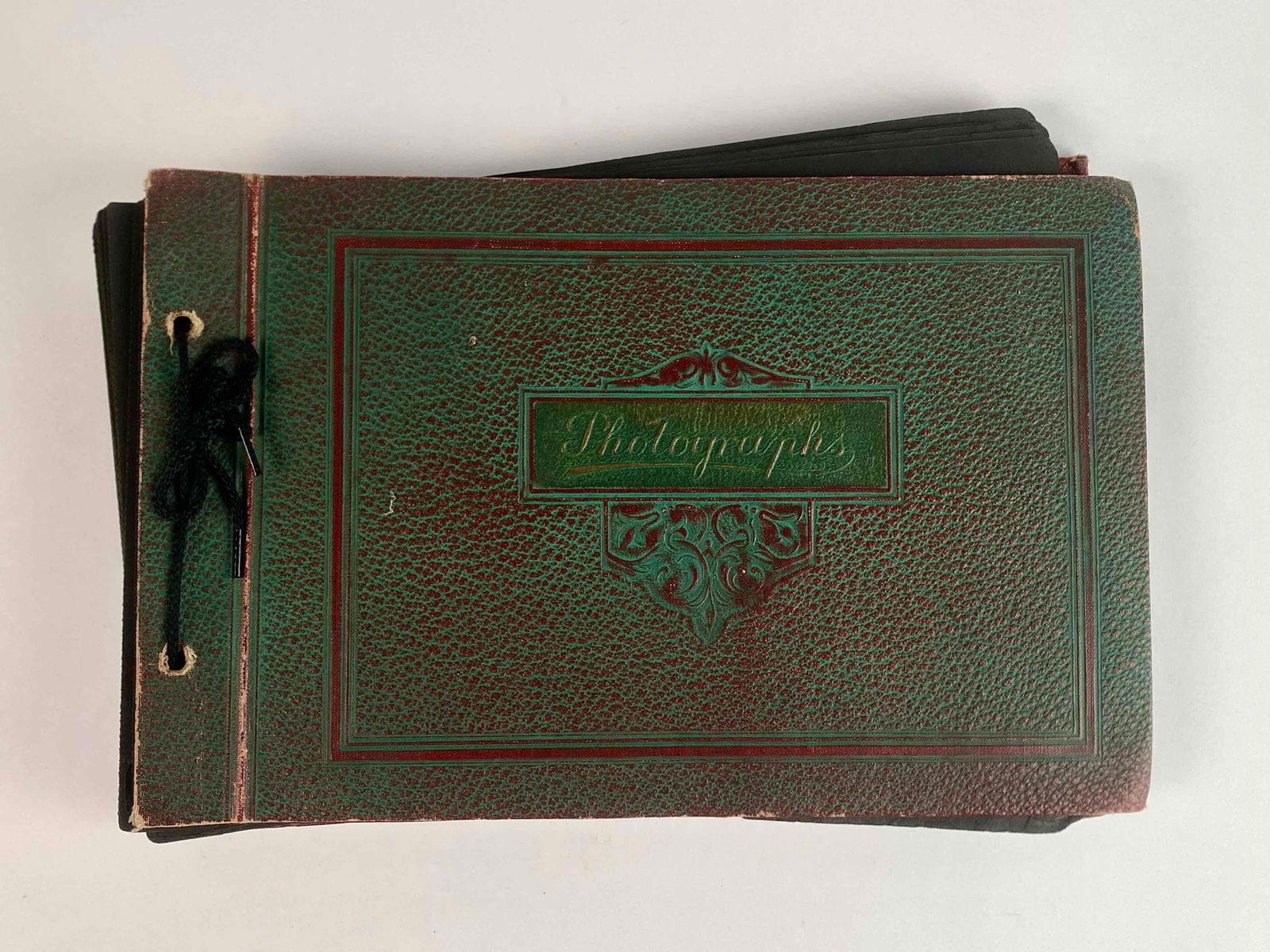 Antique Family Photo Album with Photographs: An antique family photo album with photographs. Includes photographs of horseback riding, trips to Northern Michigan, New York City, and Niagra Falls. View additional photos here: https://drive.google