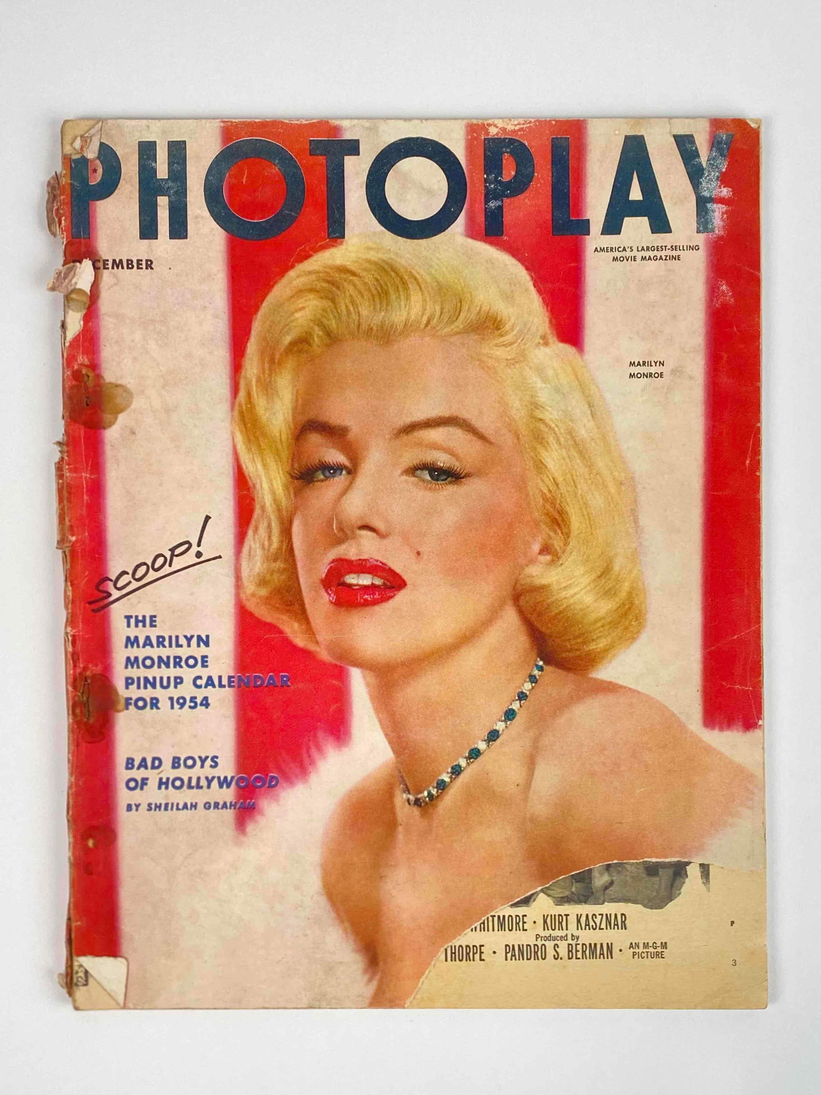 1953 Photoplay December Issue Marilyn Monroe Cover: Marilyn Monroe on the cover of Photoplay's 1953 December issue. Marilyn Monroe Pinup Calender for 1954. Includes story of the Bad Boys of Hollywood, advertisements, and more. In fair condition with si