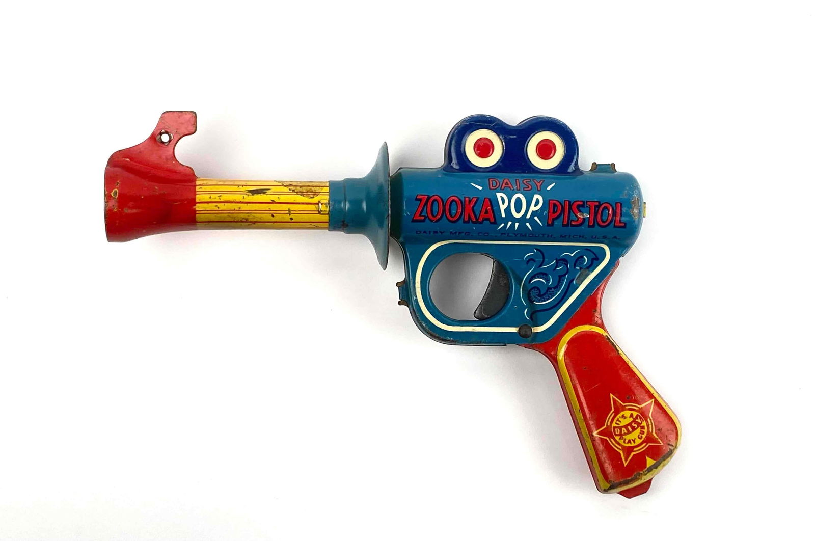 Daisy Zooka Pop Pistol Gun: A vintage Daisy Zooka Pop space pistol gun. Tin toy by Daisy MFG Co. Plymouth, Michigan, USA. Toy is in good condition with signs of wear that are consistent with age and use such as surface wear. Col