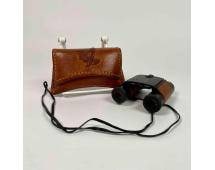 Swarovski Habicht Binoculars with Embossed Leather Case: Swarovski Habicht binoculars featuring 8x magnification and 20mm objective lens, providing a balance of performance and portability. Includes a leather strap for carrying. Accompanied by a brown embos