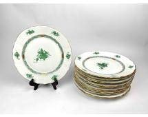 Set of 13 Herend Green Chinese Bouquet Dinner Plates: Set of 13 Herend dinner plates featuring the brandâ€™s signature craftsmanship. The plates display intricate floral motifs, gilt accents, and the iconic green Chinese bouquet pattern.