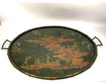 Chinoiserie Tole Piente Tray with Hand-Painted Scene: Chinoiserie tole piente tray featuring an oval, handled design in black with a detailed hand-painted scene of fantasy Chinoiseries in gilt and copper gilt. The tray is marked on the bottom as â&#