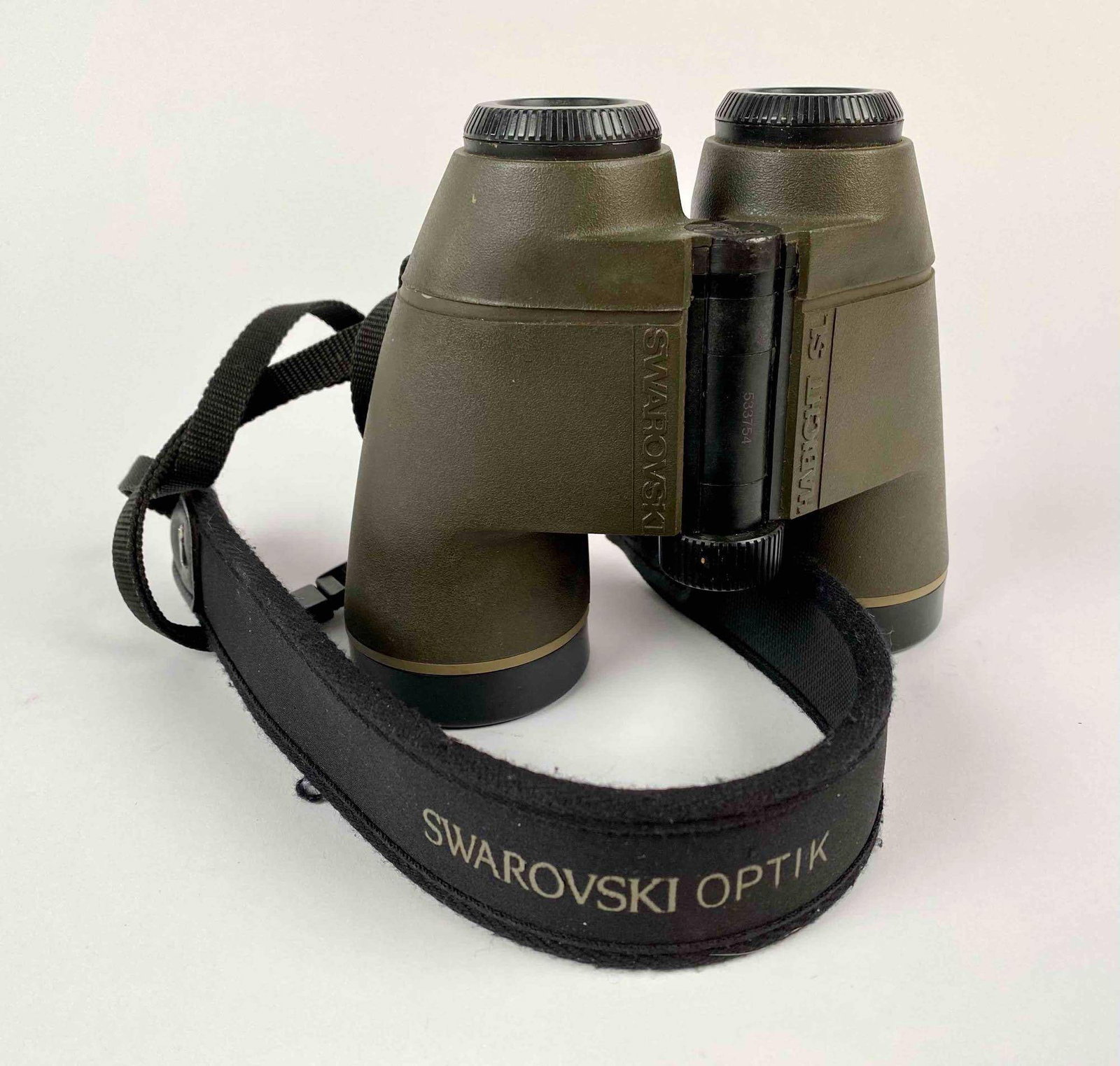 Swarovski Optik Habicht SL 10×40 Binoculars: These binoculars are Swarovski Optik’s Habicht SL with 10×40 magnification. They are an army green with black trim. The binoculars includes a Swarovski Optik camera strap adorned with two silver ea