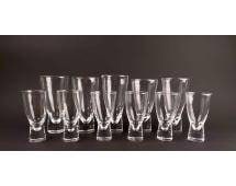 Set of 11 Steuben Crystal Glasses: 11 crystal glasses by Steuben. Glasses are in 2 different sizes and have a structural element at the base. All glasses are etched with Steuben on the bottom as pictured. Items are in good condition. P