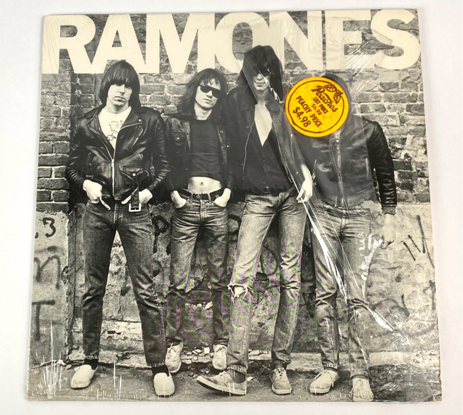 Ramones Self-Titled Vinyl Record (1976, Sire SR 6020): Ramones self-titled vinyl record released in 1976 under Sire Records (SR 6020). Original pressing. Includes the LP, outer sleeve with artwork, and inner sleeve with imagery and lyrics. Produced by Cra