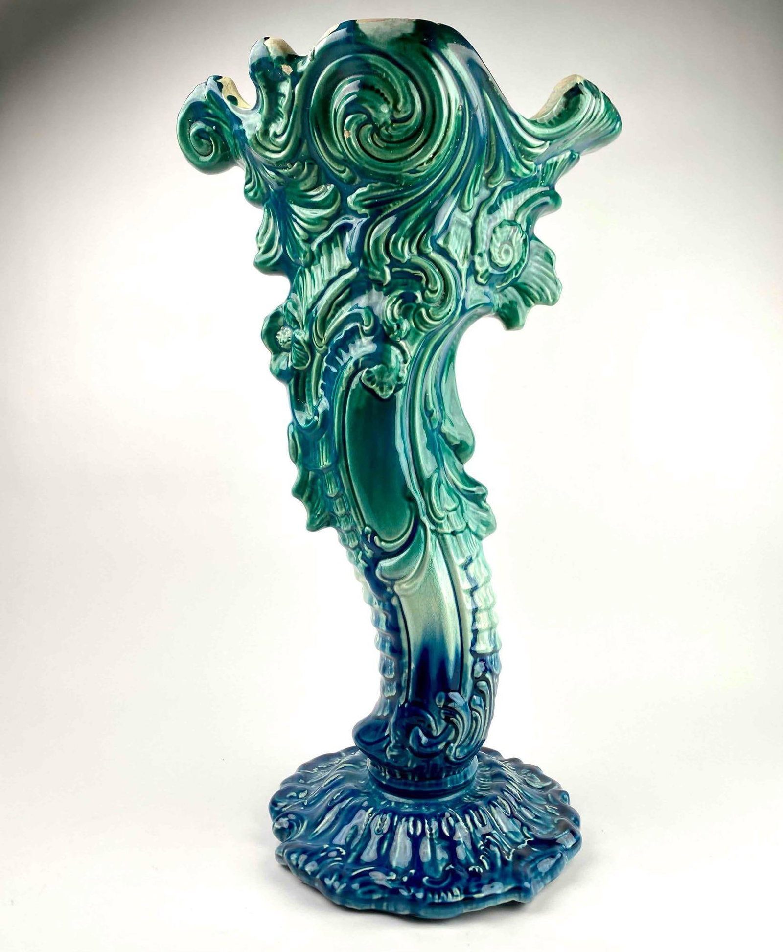 Majolica Umbrella Stand: Large Majolica umbrella stand. Item is in multiple shades of blue and green and is in good condition as pictured. Umbrella stand is hallmarked. Please see photos for additional details. Dimensions: 13