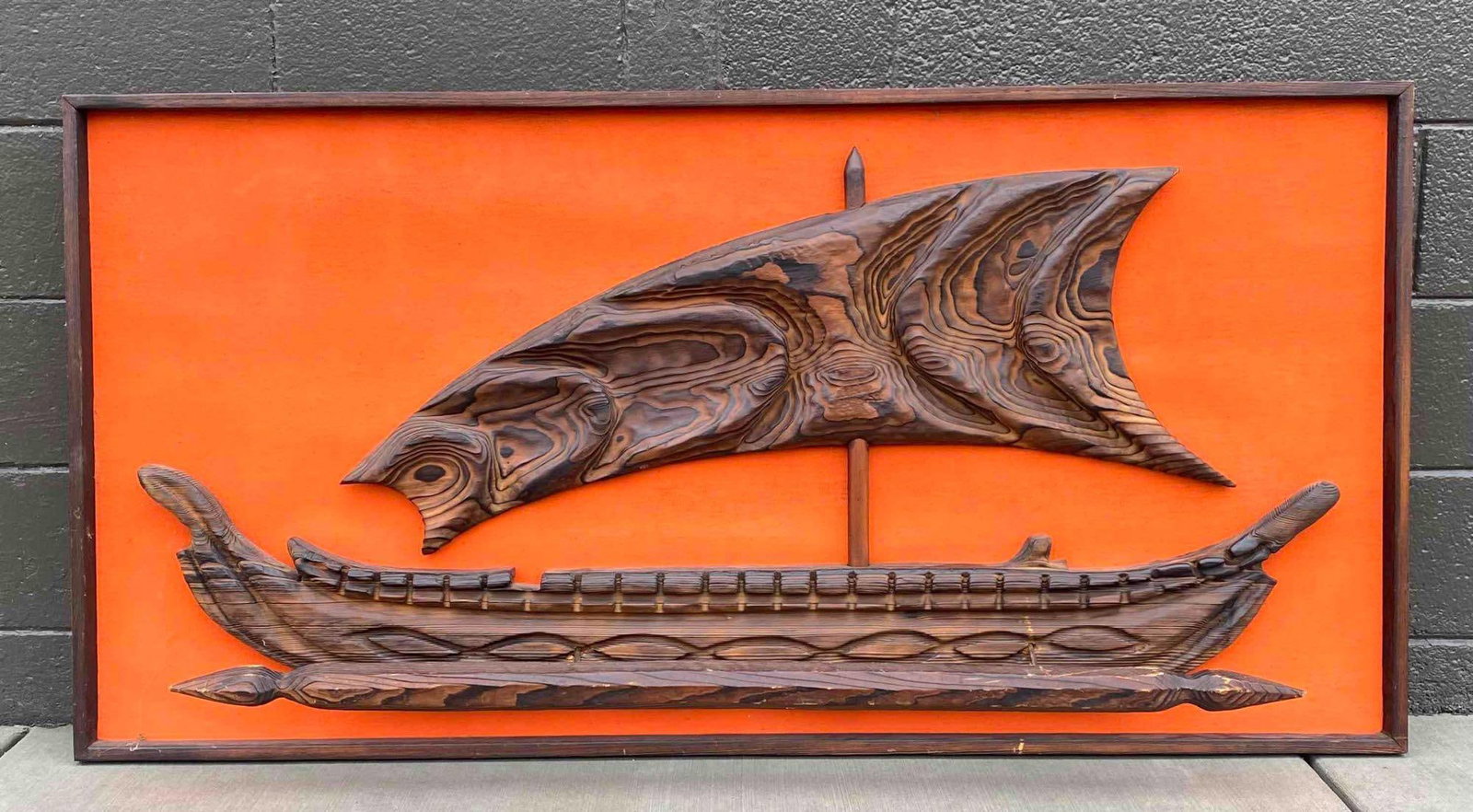 Witco Wilrongo "Outrigger" Viking Ship Wall Art from 1960s: Witco Wilrongo "Outrigger" Viking ship wall art from the 1960s. Constructed of carved wood with intricate design details and set against an orange backdrop in a rectangular wooden frame. The lower pie