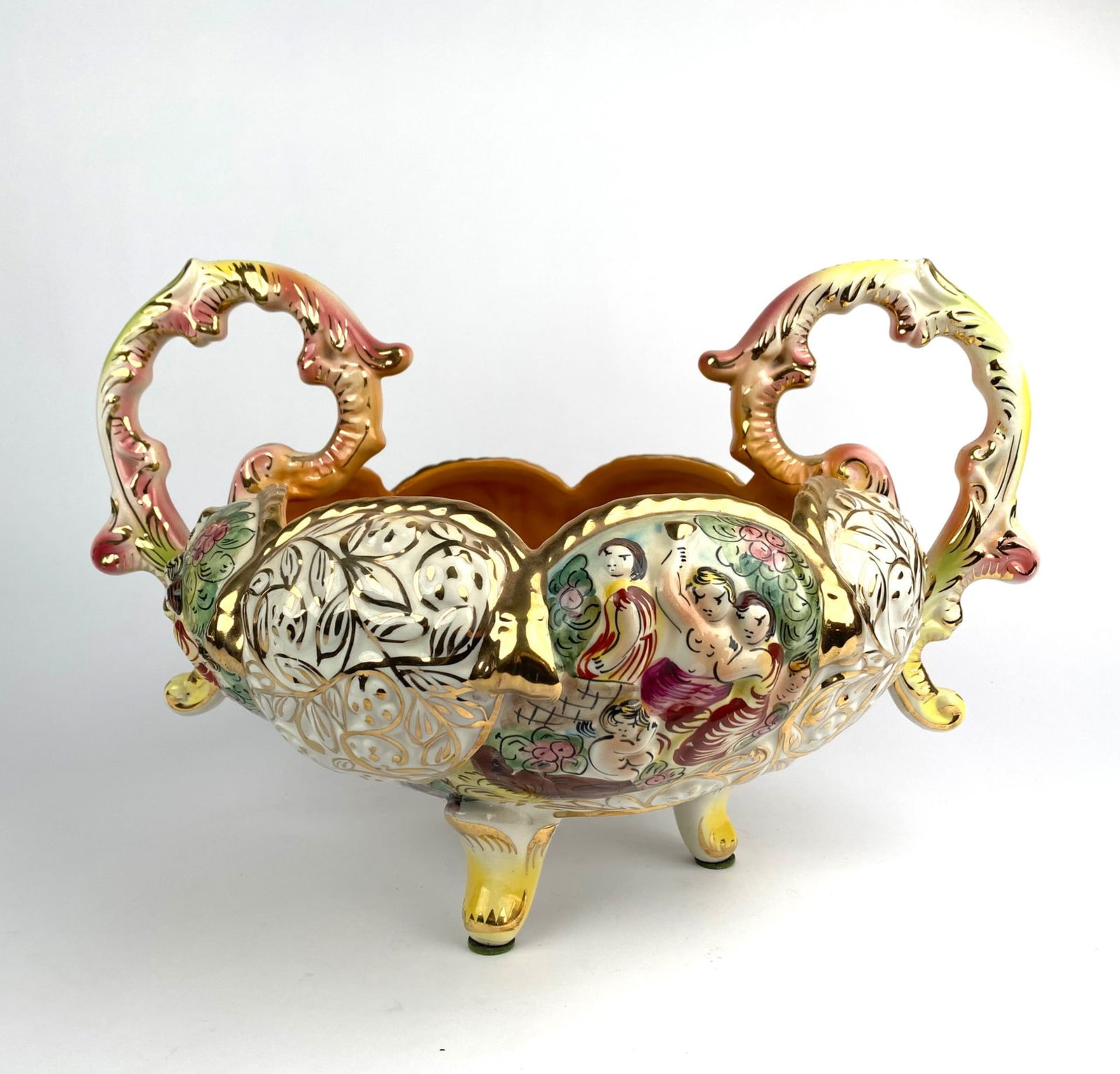 Capodimonte Italy Decorative Handled Footed Bowl, 2001: Capodimonte decorative porcelain bowl, marked ‘2001 Capodimonte Made in Italy’ on the base. Features ornate handles, detailed floral and figural decoration, and gold-toned finishing. Supported by