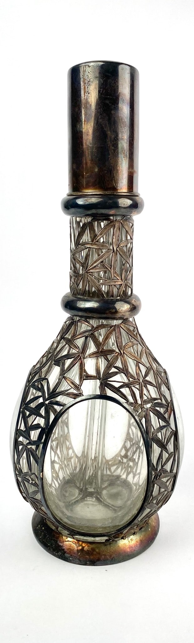 Sterling Silver Overlay Glass Decanter with Bamboo Design and Removable Cap: Sterling silver overlay glass decanter featuring an intricate bamboo motif. The overlay includes polished silver details, and the piece comes with a removable silver cap and inner stopper. Stamped 'St