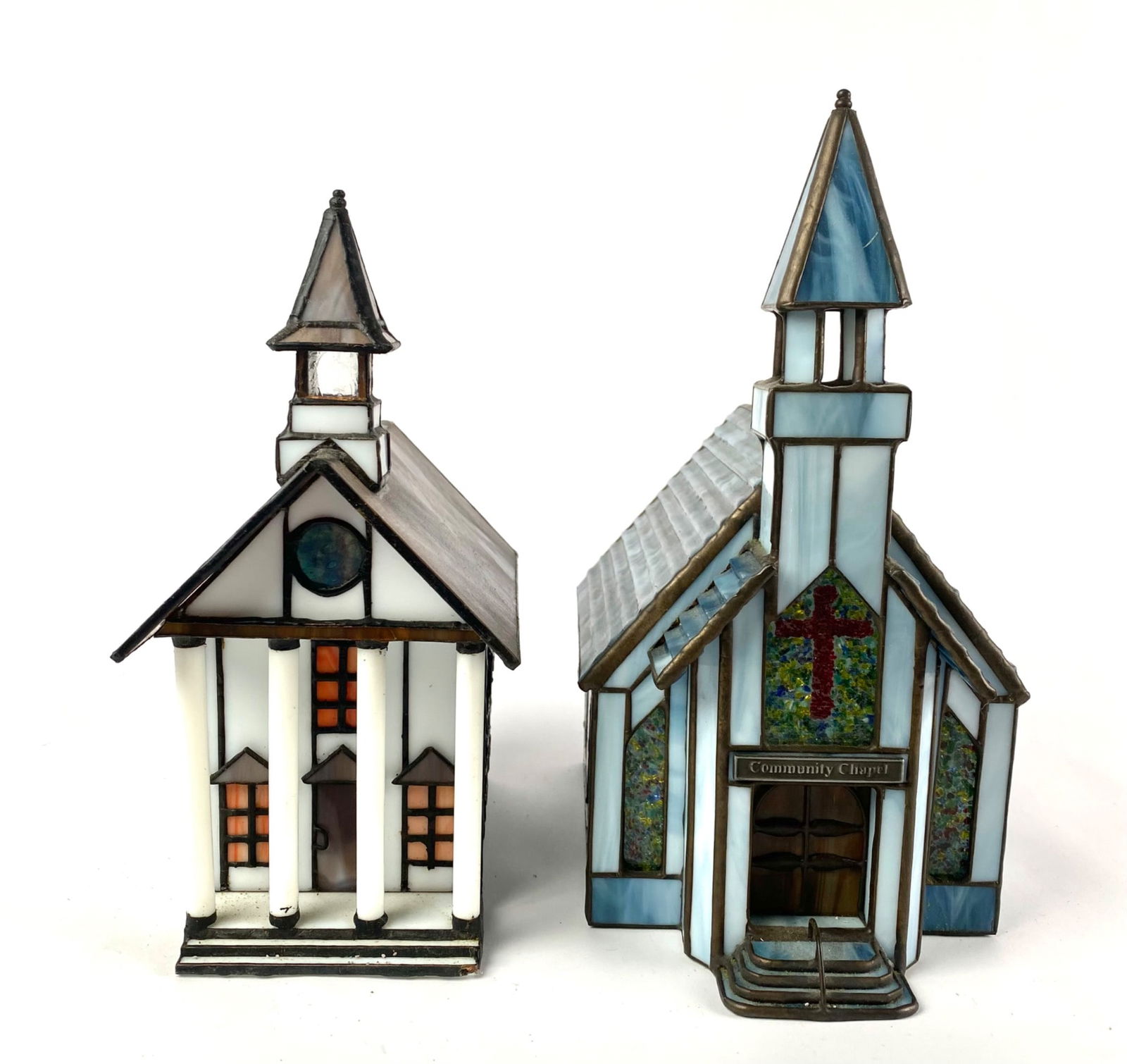 Forma Vitrum Stained Glass Church Replicas with Original Boxes: Pair of Forma Vitrum stained glass church replicas, featuring intricate designs and vibrant colors. Includes one white church with orange-accented windows and one blue ‘Community Chapel’ with colo