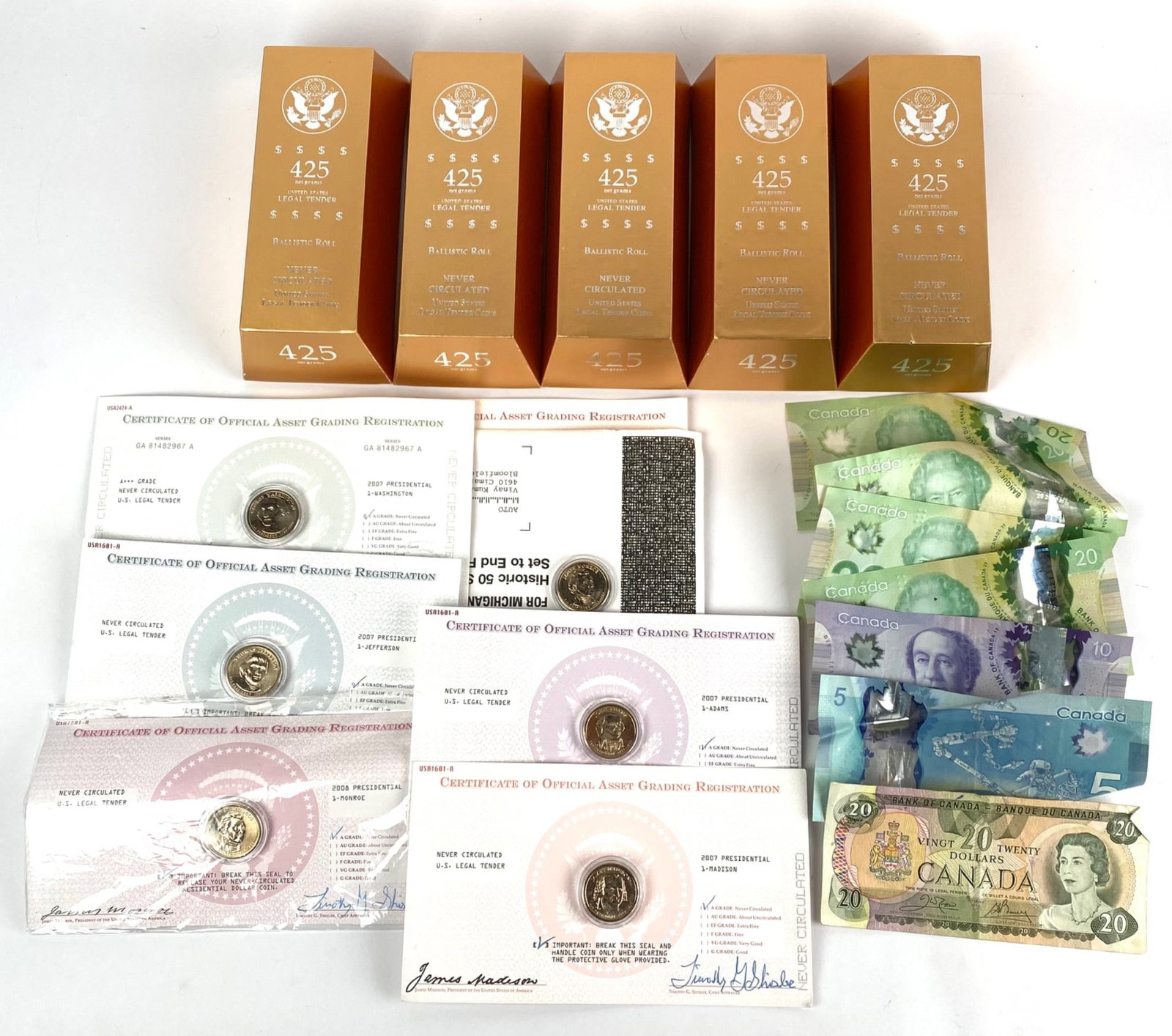 Uncirculated U.S. 425 Ballistic Rolls, Canadian Currency, and Certificates Lot: Lot includes 5 rolls of uncirculated United States 425th-Anniversary ballistic rolled coins in original packaging, a mix of Canadian banknotes (some showing damage), and a group of 6 certificates of o