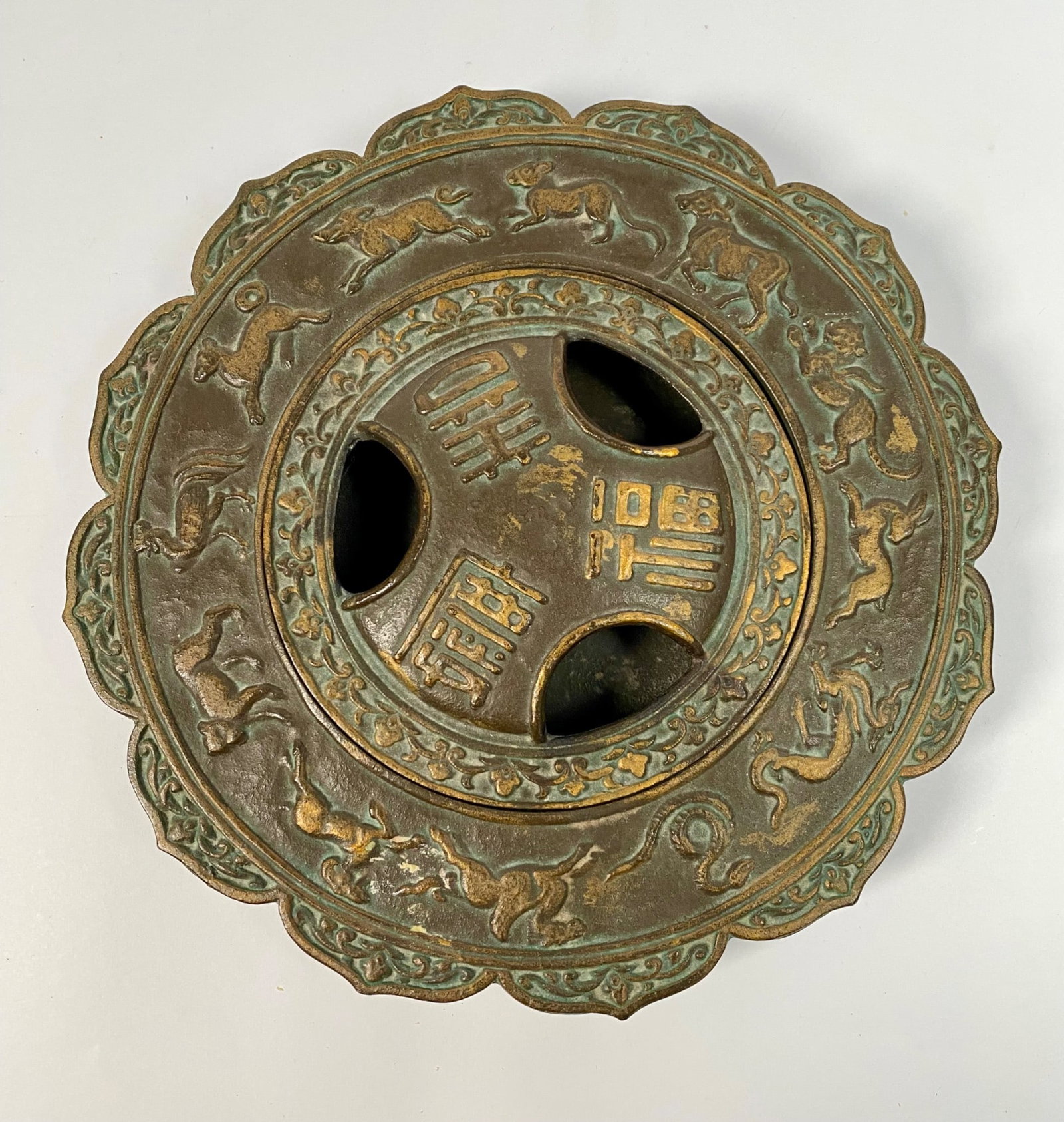 Japanese Bronze Zodiac Incense Burner: Japanese bronze incense burner with removable lid. Featuring detailed animal motifs of the 12 zodiac animals and symbolic inscriptions. The scalloped edges and intricate design demonstrate craftsmansh