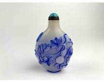Chinese Overlay Glass Snuff Bottle with Blue Floral Design: Chinese snuff bottle with glass overlay. Snuff bottle is white with blue overlay and a turquoise style cap. Bottle and scoop are in good condition. Please see photos for additional details. | Dimensio