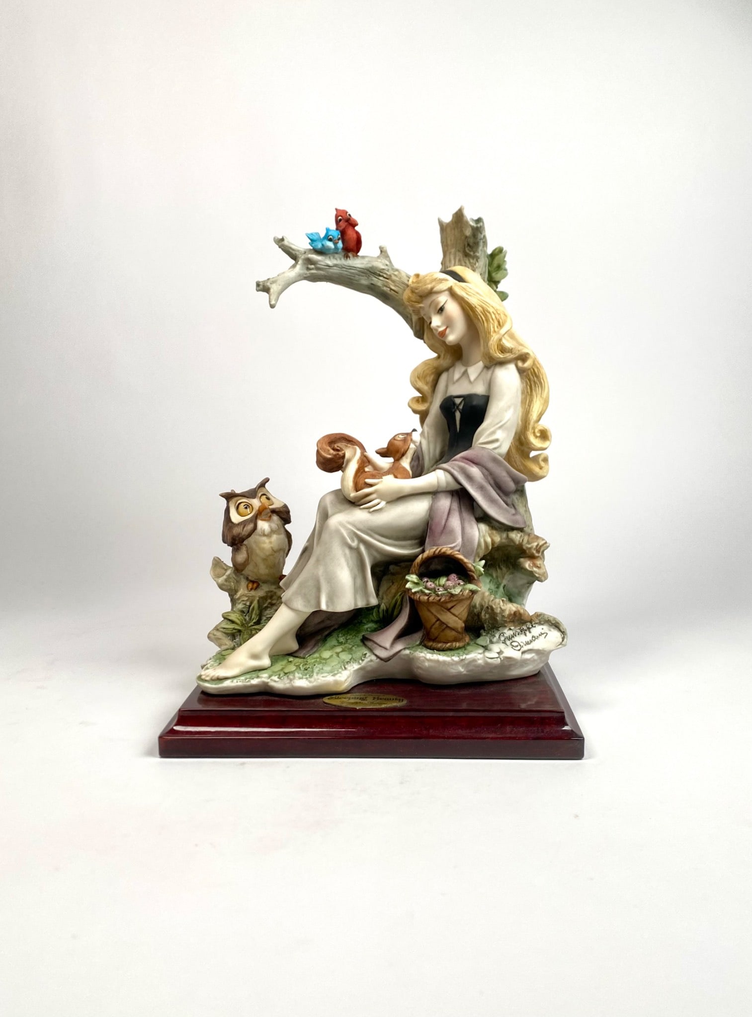 Disney Sleeping Beauty by Giuseppe Armani (Original Box): Handcrafted porcelain figurine of Disney Sleeping Beauty. Designed by Giuseppe Armani and produced by Florence in Italy and dated 1996. Features intricate detailing with a natural scene including anim