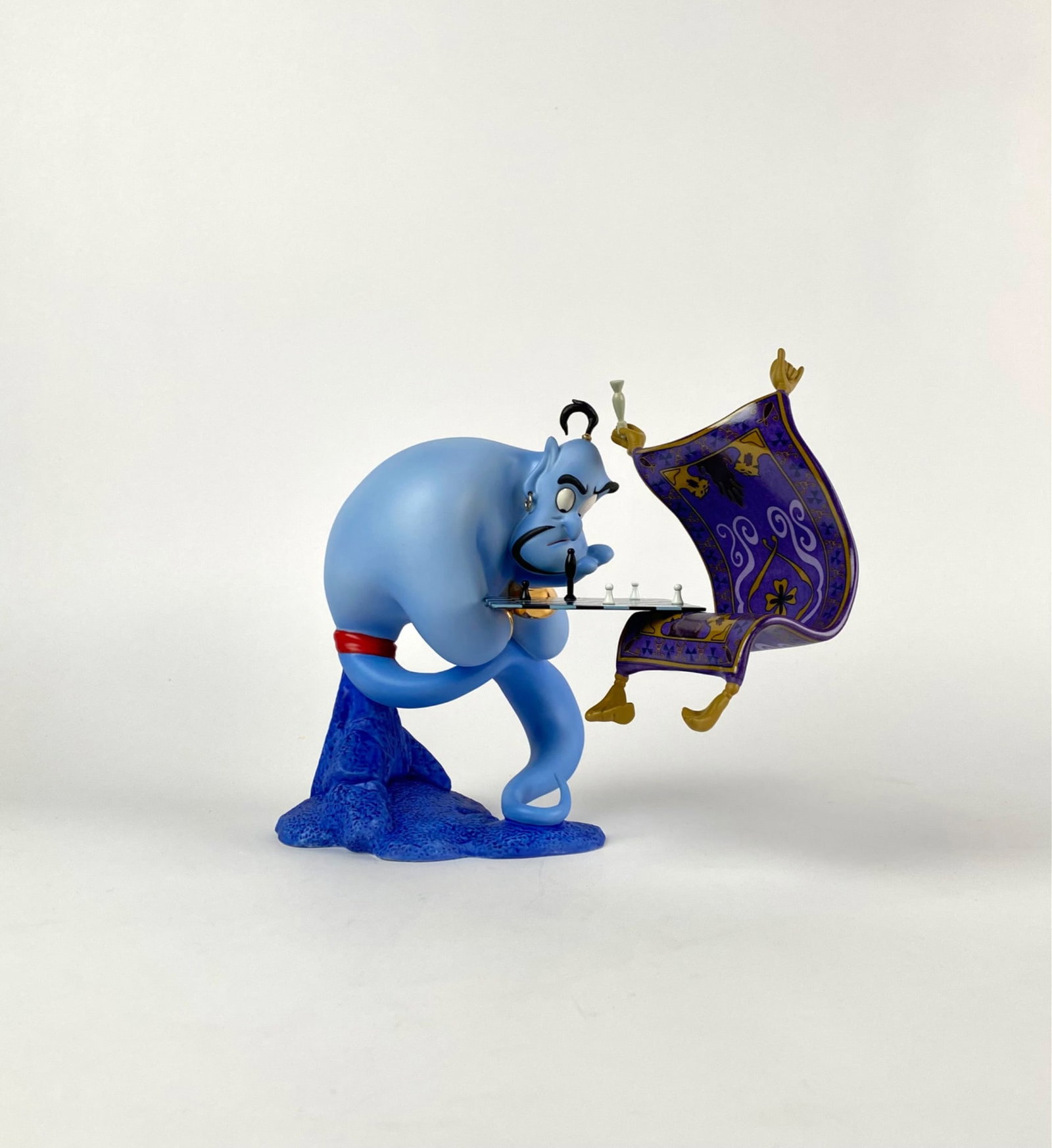 Disney Classic Collection Im Losing to a Rug (COA Original Box): Limited edition Walt Disney Classics Collection figurine titled Iâ€™m Losing to a Rug, featuring Genie playing chess with the Magic Carpet from Disney Aladdin. Crafted from porcelain,
