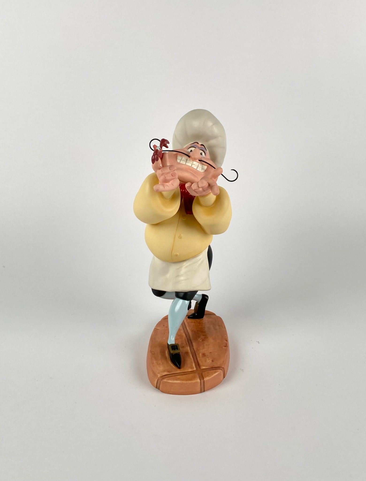Walt Disney Classics Collection Chef Louis (COAs Original Box): Walt Disney Classics Collection figurine featuring Chef Louis from The Little Mermaid entitled Zut Alors! I Have Missed One!. Sculpted in porcelain with detailed hand-painted features. Includes a Cert