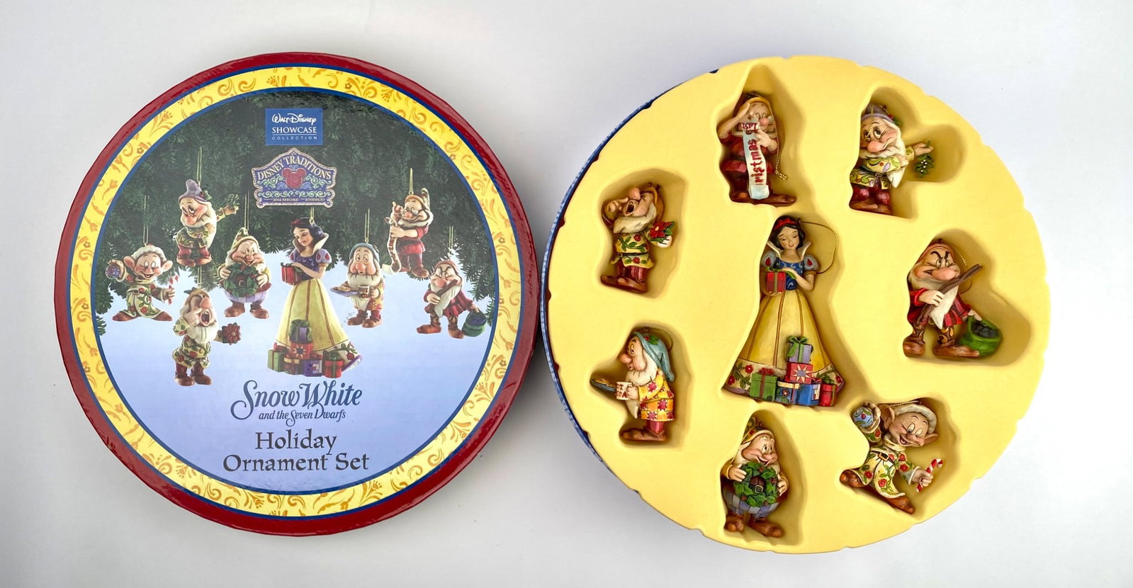 Disney Snow White and the Seven Dwarfs Holiday Ornament Set: Disney Showcase Collection Holiday Ornament Set featuring Snow White and the Seven Dwarfs. Includes a total of 8 hand-painted resin ornaments designed for hanging. Each ornament showcases intricate de