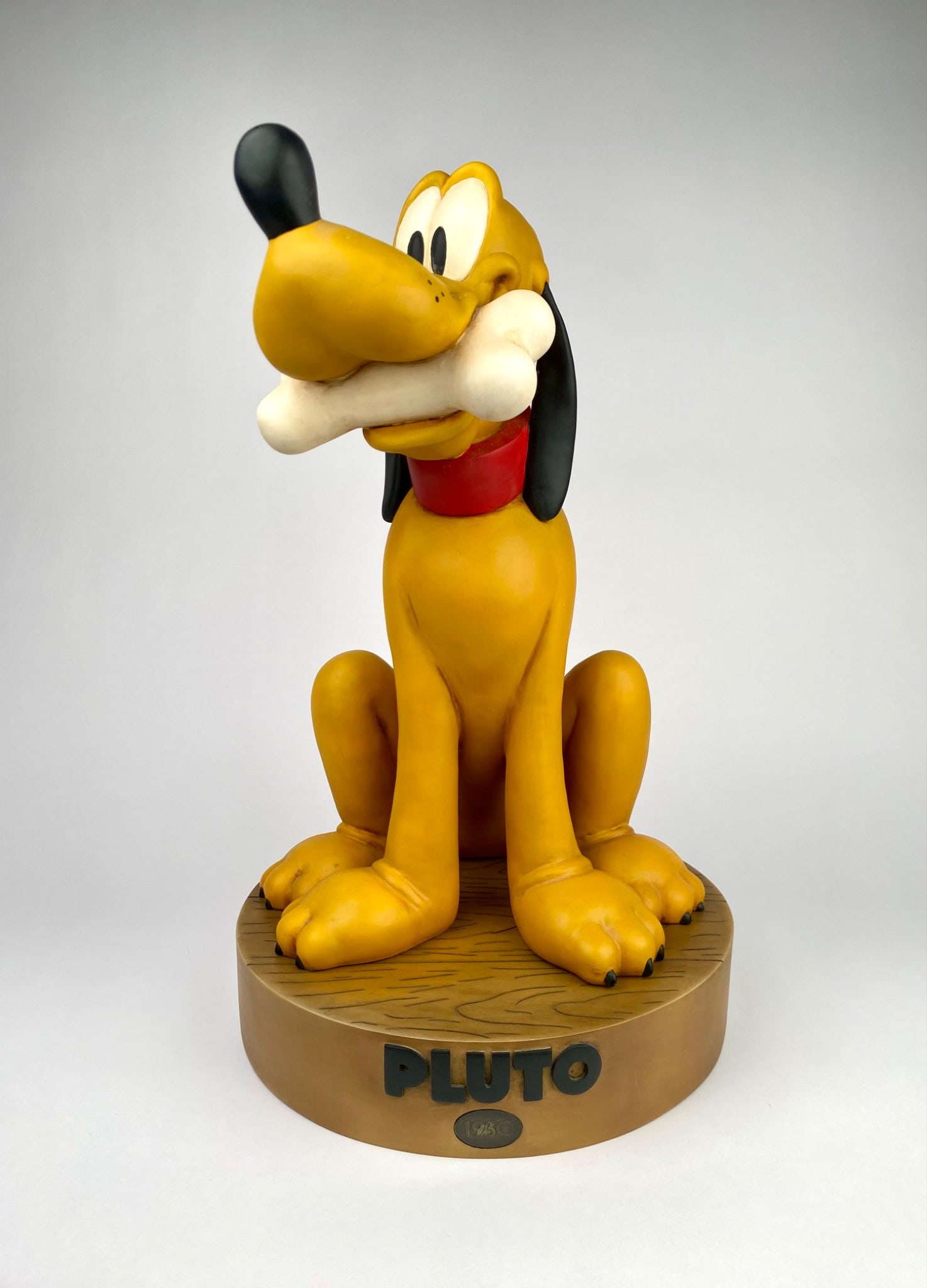 Big Fig Disney Pluto: Large limited edition Pluto figurine produced by Disney China to commemorate Plutoâ€™s debut in 1930. The figurine features Pluto sitting on a wood-textured base marked with PLUTO and