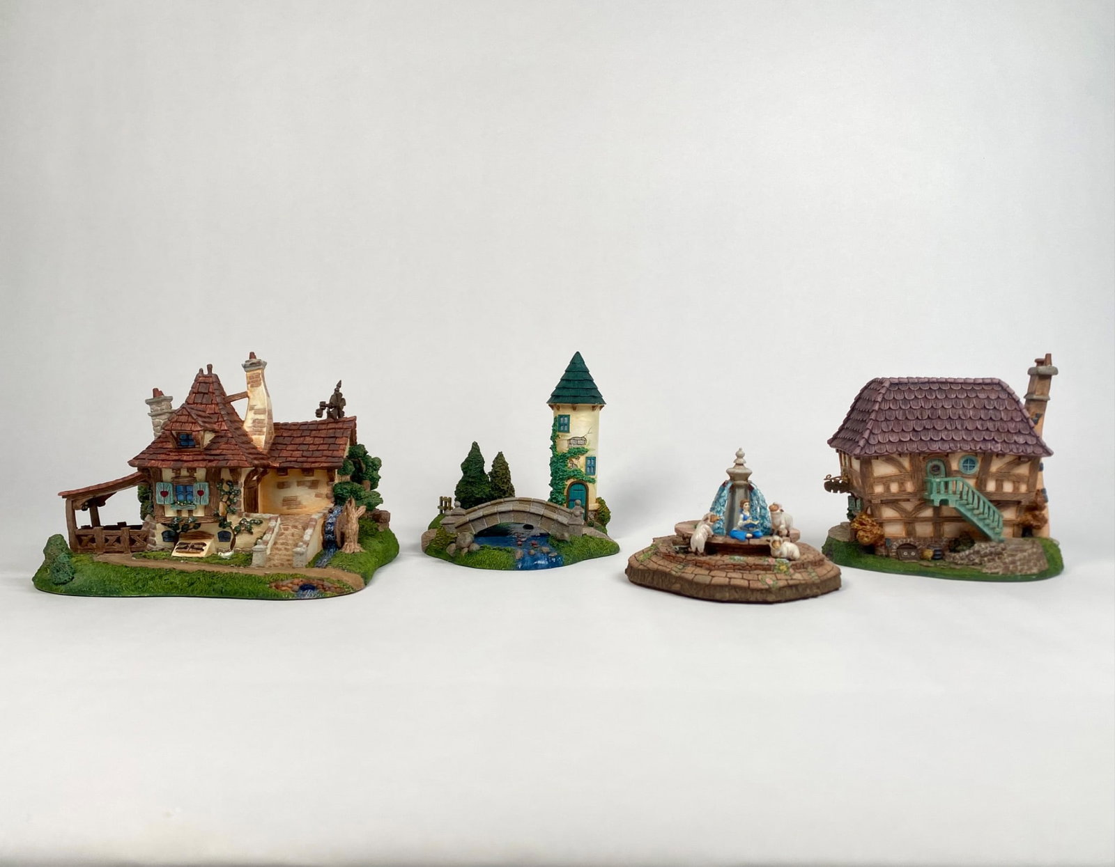 Disney Classics Collection Beauty and the Beast (Original Box): Set of four Walt Disney Classics Collection figurines, including Belle and Fountain, Bridge and Tower, Boulangerie and Belle and Mauriceâ€™s Cottage. Each intricately detailed figurin