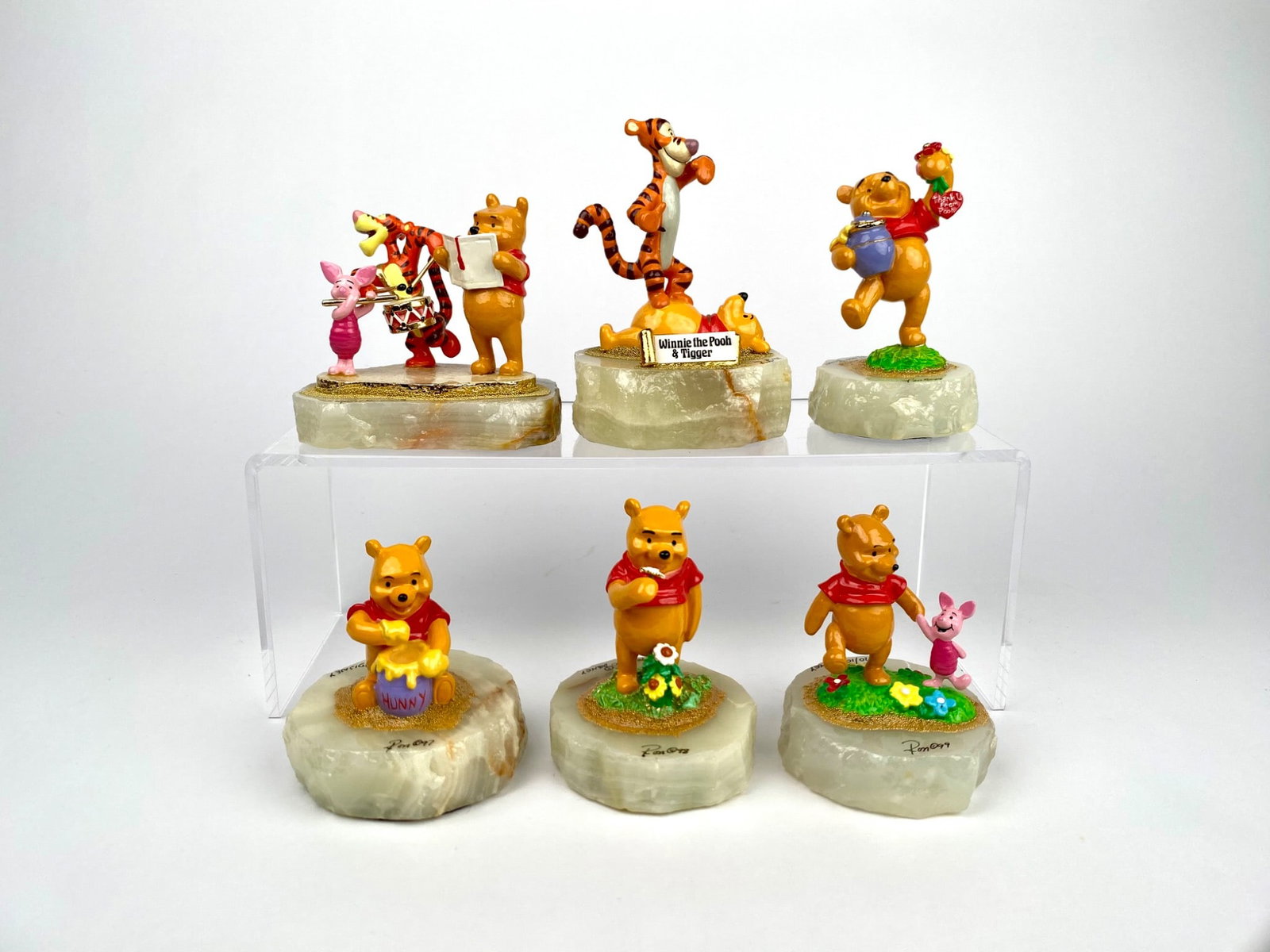 Lot of 6 Ron Lee Disney Winnie the Pooh and Friends Figurine: Set of six Disney Winnie the Pooh character figurines affixed to onyx bases. Characters include Winnie the Pooh, Piglet, Tigger, and companions showcasing various activities. Each figurine is crafted 
