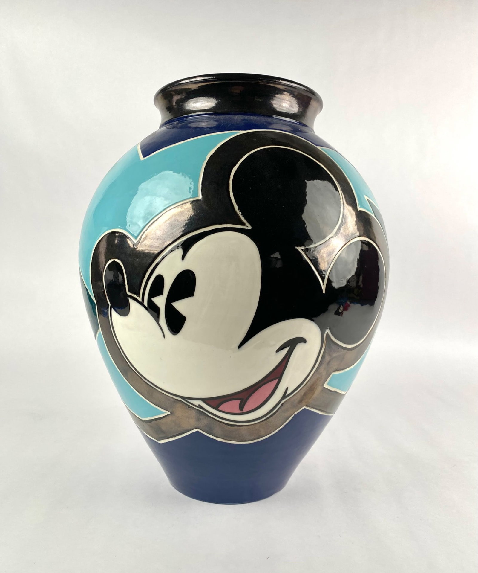 Elisabete Gomes Micky Mouse Limited Edition Vase: Limited edition ceramic vase designed by Elisabete Gomes, featuring a signature Disney design of Mickey Mouse and geometric patterns in vivid colors. Marked on the base with Elisabete Gomes, 12/75, Di