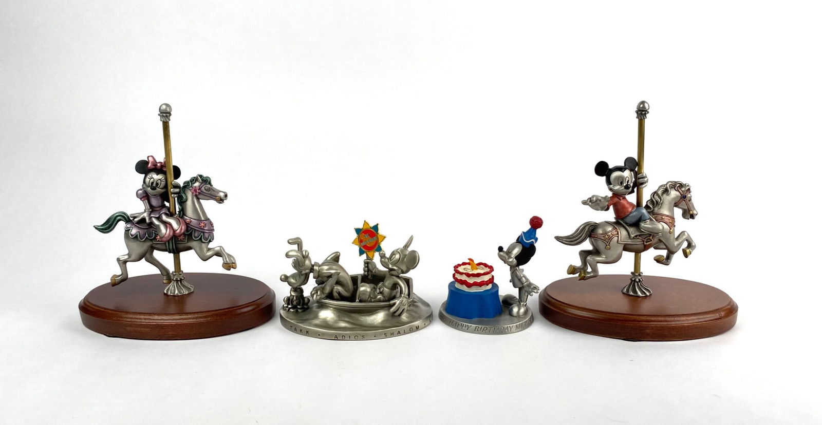 Set of Walt Disney Pewter Figures Featuring Mickey and Minnie Mouse: Collection of Walt Disney pewter figures, featuring Mickey and Minnie Mouse. Includes Mickeyâ€™s Carousel Ride and Minnieâ€™s Carousel Ride, both limited editions by