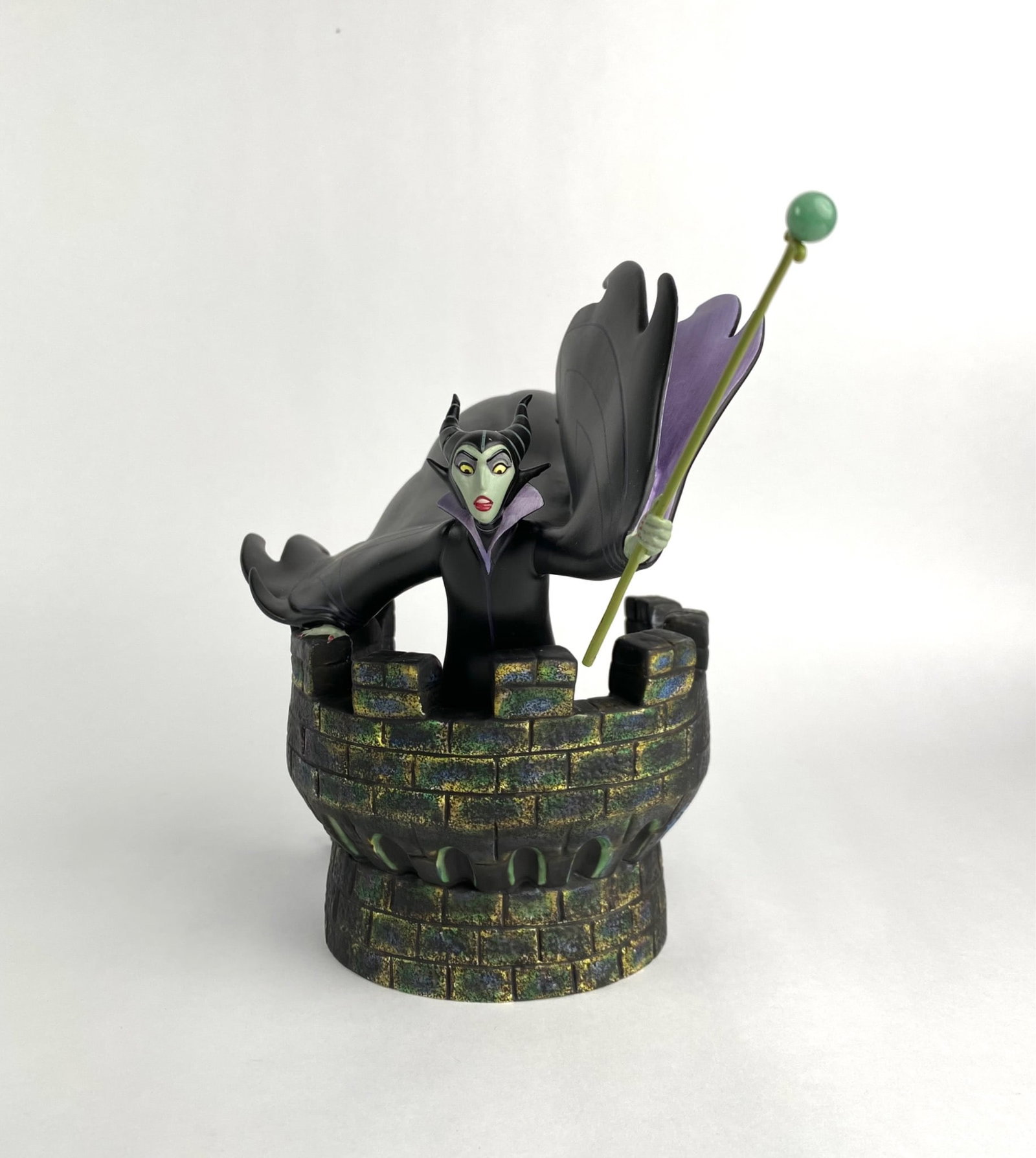 Disney Villains Collection Maleficent Figurine (Original Box COA): Disney Villains figurine titled The Mistress of All Evil, representing Maleficent from Sleeping Beauty. Made of resin or similar material, the piece features Maleficent atop a castle tower holding her