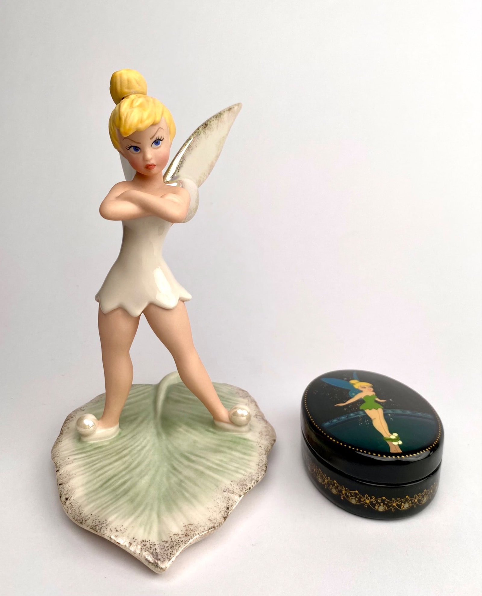 Lenox Tinker Bell Figurine and Russian Lacquer Box: Lenox porcelain figurine of Tinker Bell on a leaf base, marked on the underside with Disney Showcase Collection and other details. This piece features iridescent wings and pearl accents. Accompanied b