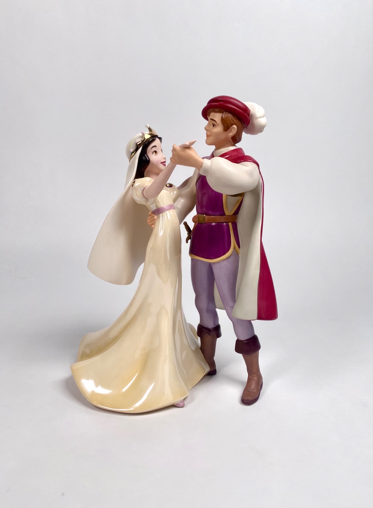 A Dance Among the Stars Snow White and Prince Figurine by Walt Disney Classics Collection: Porcelain figurine titled 'A Dance Among the Stars' by Walt Disney Classics Collection featuring Snow White and Prince from Disney's Snow White and the Seven Dwarfs. Includes the original box and Cert