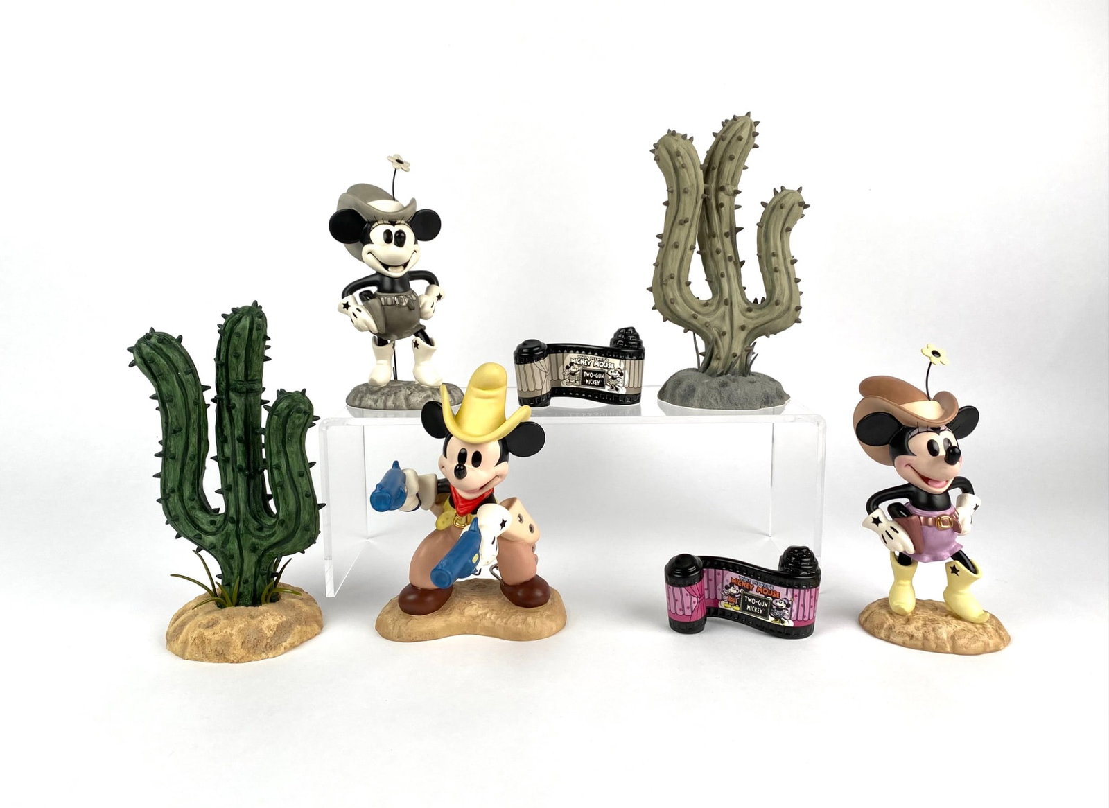 Disney Classic Collections Two Gun Mickey (Original Box COA): A complete set of Disney Collectibles commemorating the 70th Anniversary of Two Gun Mickey. Includes three figurines (Two Gun Mickey, Queen Lil Critter, and a matching cactus figurine), along with two
