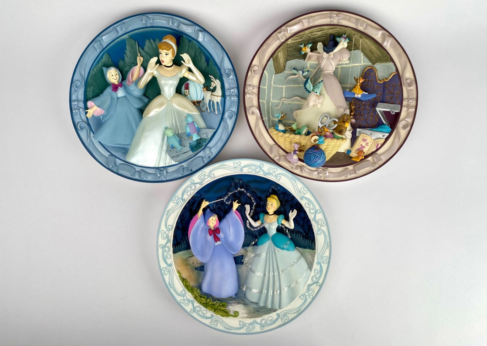 Set of 3 Disney Cinderella Collectible 3D Wall Plates: Set of 3 collectible Disney 3D wall plates from the Cinderella series, each portraying classic scenes. Includes the following plates We Can Do It, Cinderella 1950, and A Wonderful Dream Come True. Eac