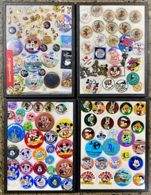 Collection of Disney Buttons and Enamel Pins in 4 Display Cases