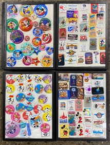 Collection of Disney Buttons and Magnets in Display Cases