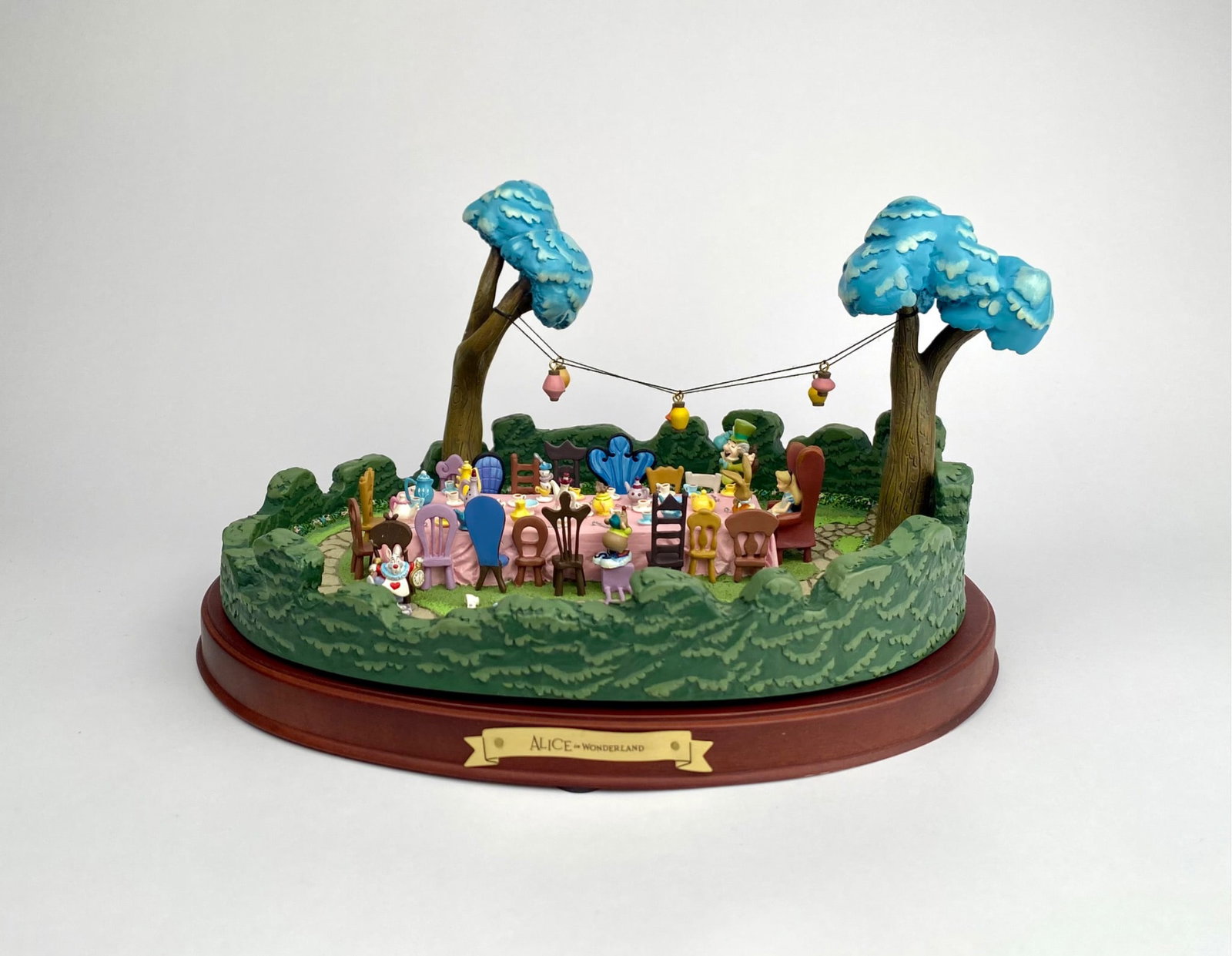 Disney Alice in Wonderland Figurine Display: Disney Enchanted Places A Tea Party in Wonderland collectible figurine display depicting the Mad Hatters tea party scene from Alice in Wonderland. Constructed with fine detail and crafted from resin o