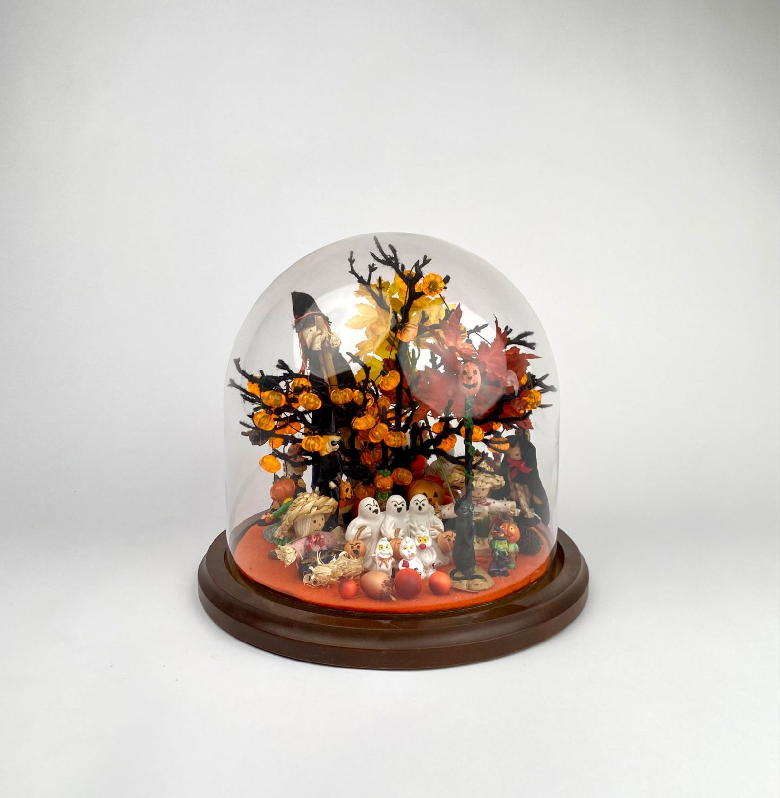 Halloween Themed Domed Diorama Display: Halloween themed artistic display featuring a variety of seasonal figurines and decorations within a glass dome. Includes miniature ghosts, pumpkins, scarecrows, witches, and other autumnal details, m