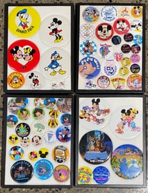 Collection of Disney Character Buttons and Pins in Display Cases