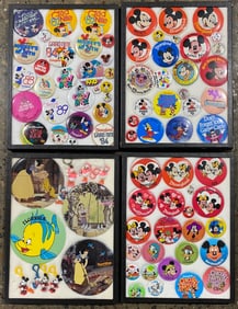 Collection of Buttons and Keychains of Disney Characters and Events