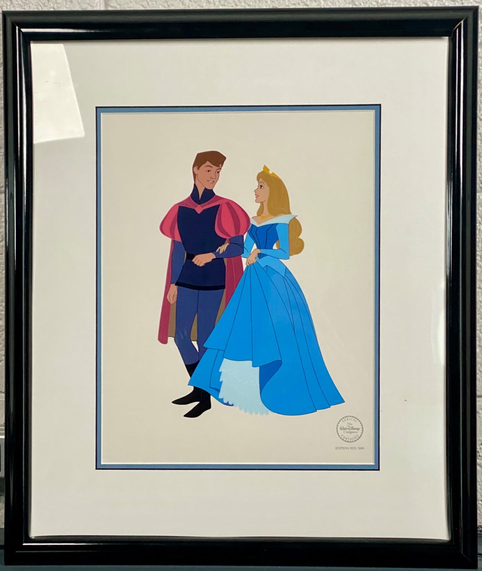 Disney Sleeping Beauty and Prince Sericel Animation Art: Framed sericel featuring Sleeping Beauty and Prince from Walt Disney Animation Art. Edition size: 5000. Includes Disney’s certification seal on the sericel. Glazing is plexiglass, with manufacturer�
