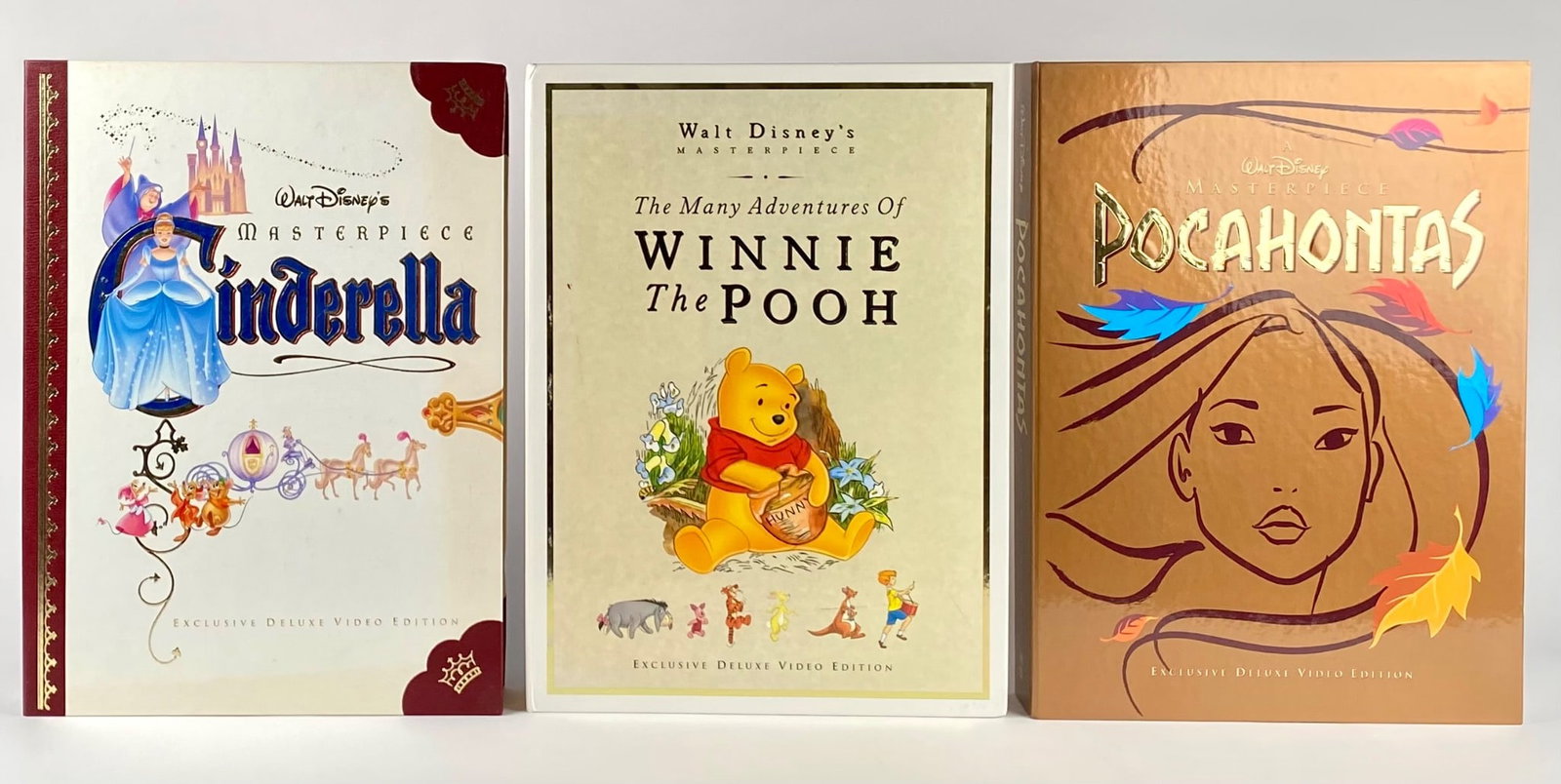 Lot of 3 Walt Disney Masterpiece Exclusive Deluxe Editions (COAs): Lot of 3 Walt Disney Masterpiece Exclusive Deluxe Video Editions, including Pocahontas, The Many Adventures of Winnie the Pooh, and Cinderella. Each edition features collectible elements, including se