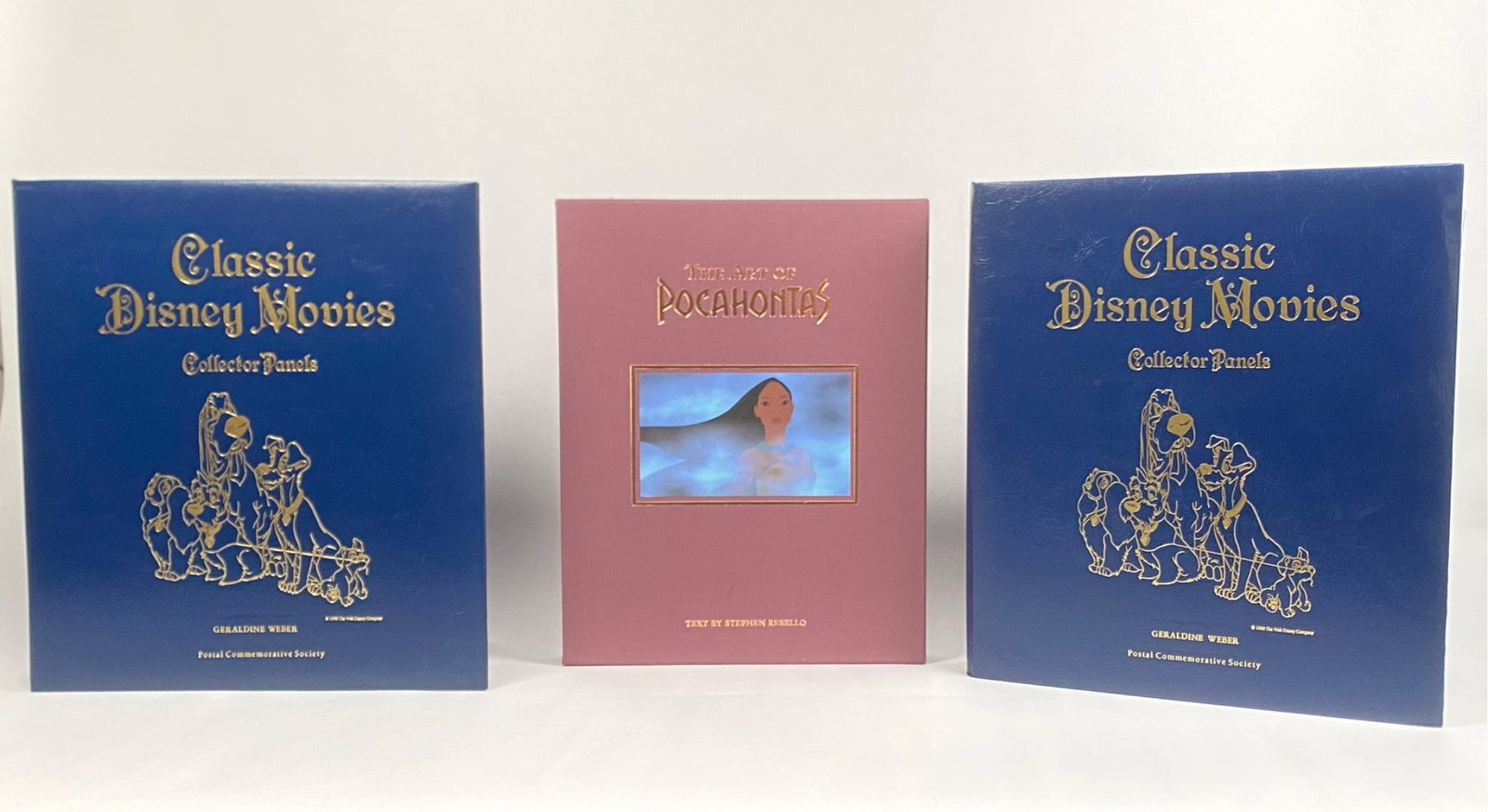 Disney Classic Movies Collector Panels and Pocahontas Art Book: Lot includes two binders of Classic Disney Movies Collector Panels featuring beloved Disney film summaries, illustrations, and accompanying collectible stamps, as well as a limited edition Pocahontas 