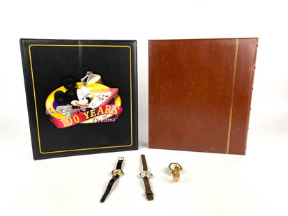 Collection of Disney Pins, Watches, and Stamps: Comprehensive collection including two albums, one with a variety of Disney pins, featuring Mickey Mouse, Winnie the Pooh, and other iconic characters, and another containing Disney themed stamps from