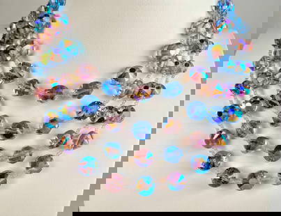 Vendome Blue and Pink Crystal Beaded Multi Strand Necklace: Vendome four strand necklace featuring faceted blue and pink iridescent glass crystal beads. Includes a silver tone floral clasp adorned with an oak leaf and flower motifs. Necklace ends with a delica
