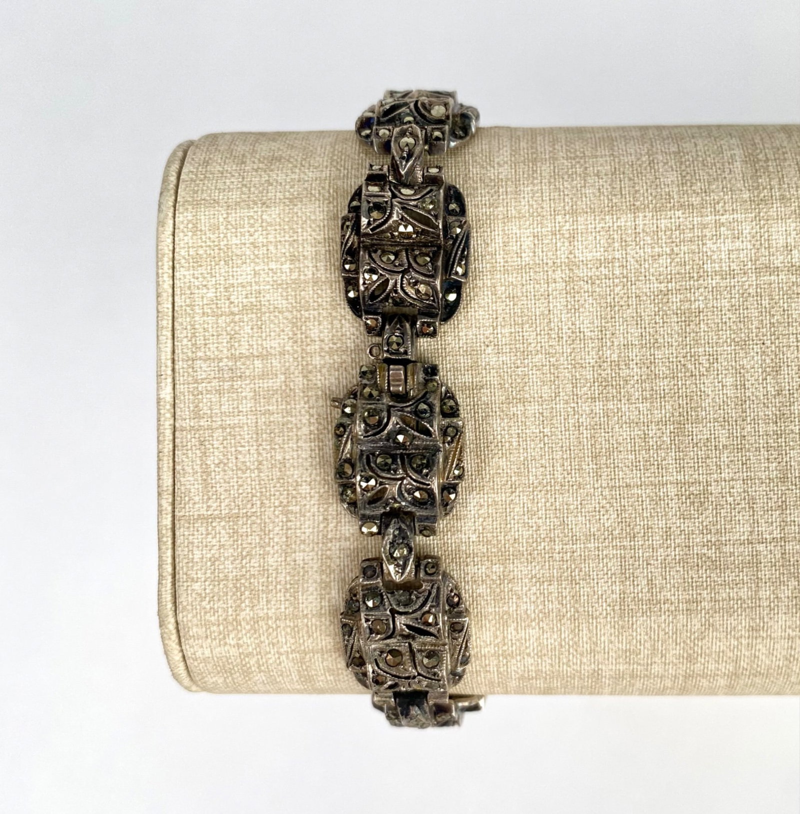 Art Deco Sterling Silver Bracelet with Rhinestones: Sterling silver bracelet featuring intricately designed panels with inset stones. Includes a secure clasp with STERLING stamped on the reverse in two locations as pictured. In good condition. Please s